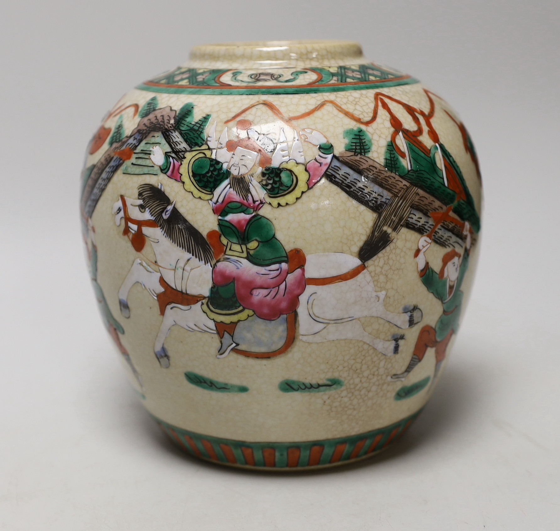 An early 20th century Chinese famille rose crackle glaze ginger jar, decorated with warrior scenes, 18cm high